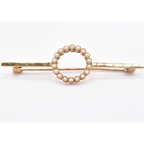 75 - A 15ct yellow gold pearl brooch with case. The 15ct yellow gold bar brooch having eighteen millegrai... 