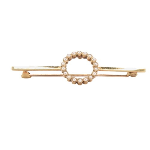 75 - A 15ct yellow gold pearl brooch with case. The 15ct yellow gold bar brooch having eighteen millegrai... 