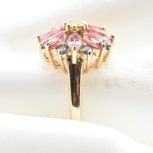 78 - A hallmarked 9ct gold, sapphire and tourmaline flower cluster ring. The 9ct yellow gold ring having ... 