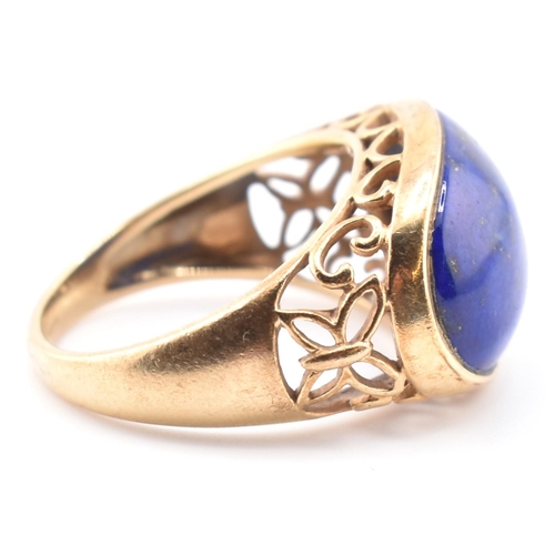 88 - A hallmarked 9ct gold and lapis lazuli dome ring. The 9ct yellow gold ring having an oval lapis lazu... 