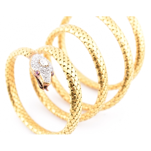 9 - A 19th century French 18ct gold diamond and ruby serpent bangle. The antique French 18ct yellow gold... 