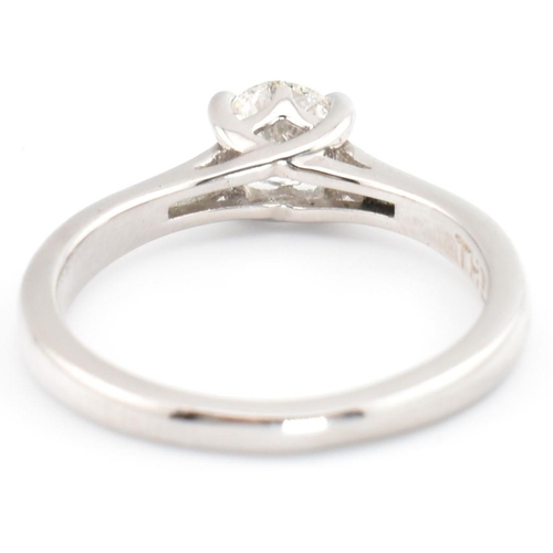 90A - A Leo Diamond 950 platinum and diamond solitaire ring. The Leo Diamond ring set with a single four c... 