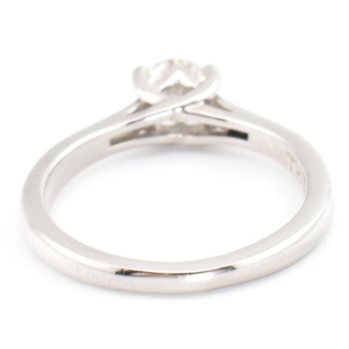 90A - A Leo Diamond 950 platinum and diamond solitaire ring. The Leo Diamond ring set with a single four c... 