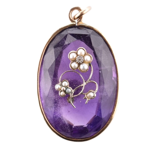 94 - A gold amethyst and pearl necklace pendant. The necklace pendant having a large oval cut amethyst wi... 