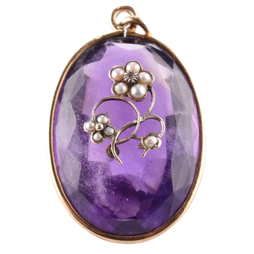 94 - A gold amethyst and pearl necklace pendant. The necklace pendant having a large oval cut amethyst wi... 