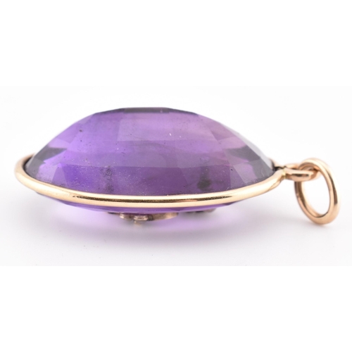 94 - A gold amethyst and pearl necklace pendant. The necklace pendant having a large oval cut amethyst wi... 