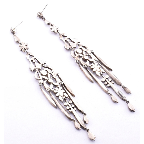 95 - A pair of antique paste pendant earrings. The silver chandelier pendant earrings set with round cut ... 