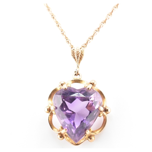 96 - A gold and amethyst heart pendant necklace. The pendant necklace having a heart cut amethyst set in ... 