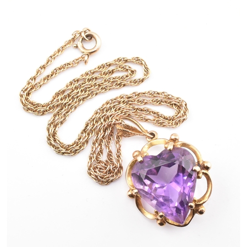 96 - A gold and amethyst heart pendant necklace. The pendant necklace having a heart cut amethyst set in ... 