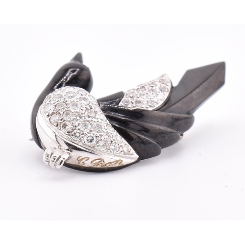 24 - A French hallmarked 18ct gold and diamond Art Deco magpie brooch pin. The Art Deco brooch pin in the... 