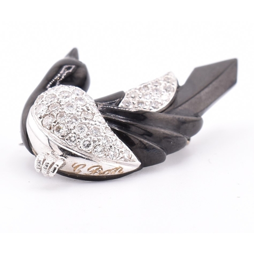 24 - A French hallmarked 18ct gold and diamond Art Deco magpie brooch pin. The Art Deco brooch pin in the... 