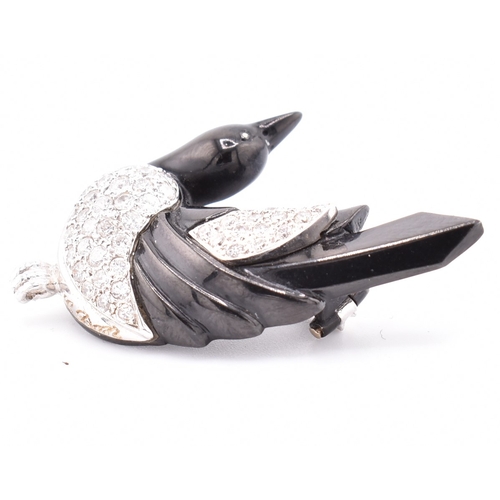 24 - A French hallmarked 18ct gold and diamond Art Deco magpie brooch pin. The Art Deco brooch pin in the... 