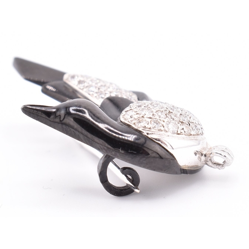 24 - A French hallmarked 18ct gold and diamond Art Deco magpie brooch pin. The Art Deco brooch pin in the... 