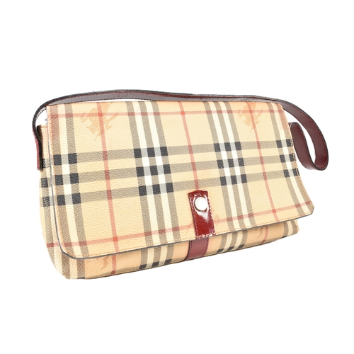 36 - A Burberry Haymarket Nova check shoulder bag. The Burberry shoulder bag having a Nova check PVC exte... 