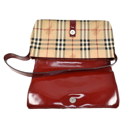 36 - A Burberry Haymarket Nova check shoulder bag. The Burberry shoulder bag having a Nova check PVC exte... 