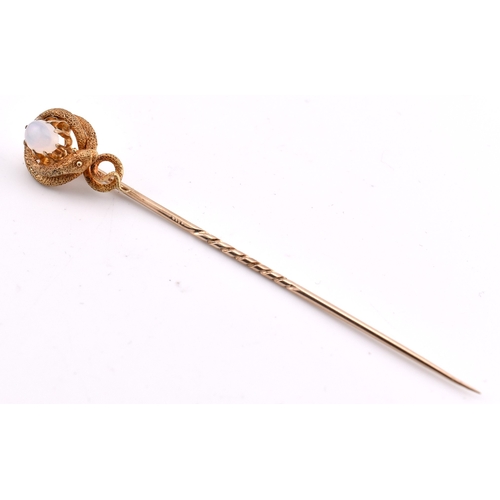 41 - A Victorian gold and opal snake stick pin. The Victorian yellow gold stick pin having a claw set opa... 