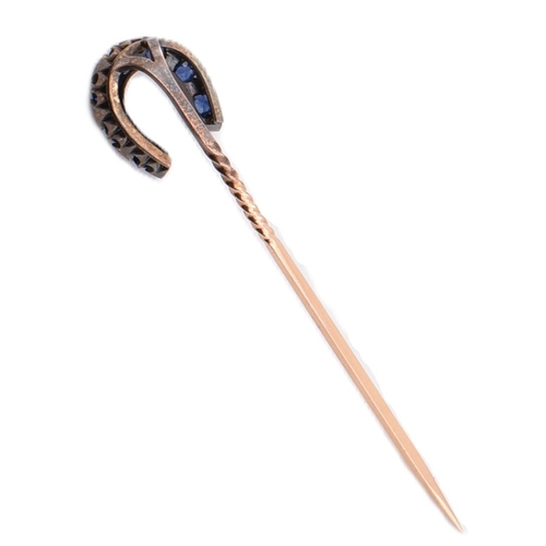 51 - A 19th century sapphire and diamond horseshoe stick pin. The antique stick pin having a horseshoe se... 