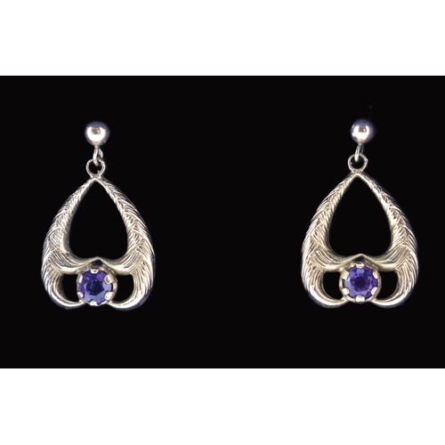 52 - A pair of hallmarked 9ct gold and purple stone pendant earrings. The 9ct yellow gold pendant earring... 