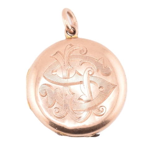 112 - A George V hallmarked 9ct rose gold engraved locket pendant. The 9ct rose gold round double sided lo... 