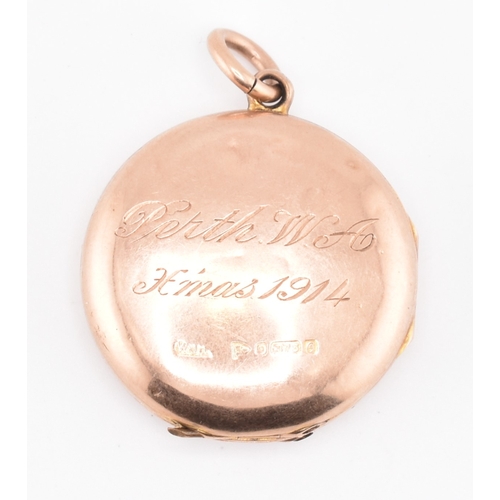 112 - A George V hallmarked 9ct rose gold engraved locket pendant. The 9ct rose gold round double sided lo... 