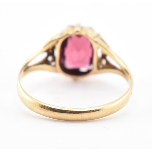 157 - An 18ct gold and garnet ring. The 18ct yellow gold ring set with a six-claw set single fancy cut gar... 