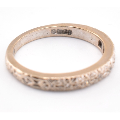 89 - A hallmarked 18ct gold and diamond half hoop ring. The 18ct white gold ring set with six illusion se... 