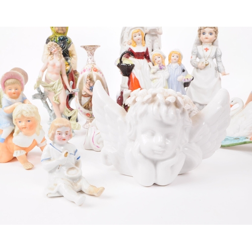 103 - A collection of late 19th / early 20th century bisque porcelain figures, examples including Nurse Cl... 