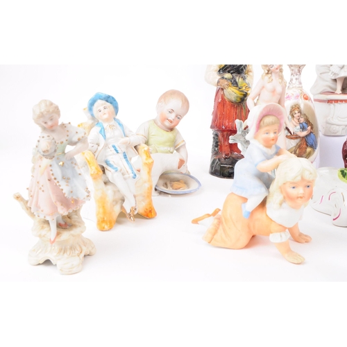 103 - A collection of late 19th / early 20th century bisque porcelain figures, examples including Nurse Cl... 