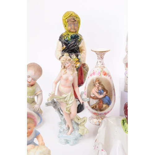 103 - A collection of late 19th / early 20th century bisque porcelain figures, examples including Nurse Cl... 