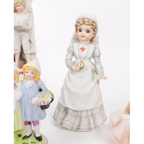 103 - A collection of late 19th / early 20th century bisque porcelain figures, examples including Nurse Cl... 