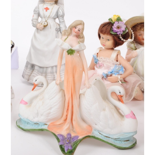 103 - A collection of late 19th / early 20th century bisque porcelain figures, examples including Nurse Cl... 