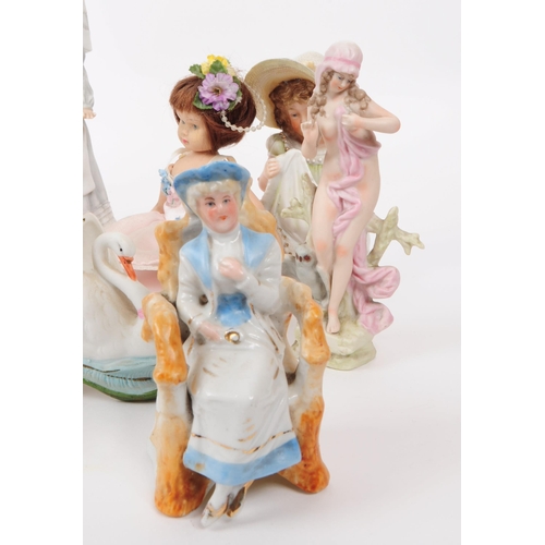 103 - A collection of late 19th / early 20th century bisque porcelain figures, examples including Nurse Cl... 