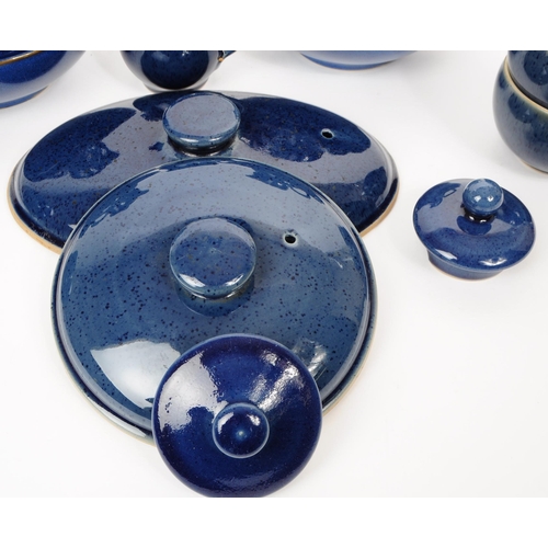 105 - A 20th century Denby part dinner service having a cobalt blue glaze consisting of various plates, di... 