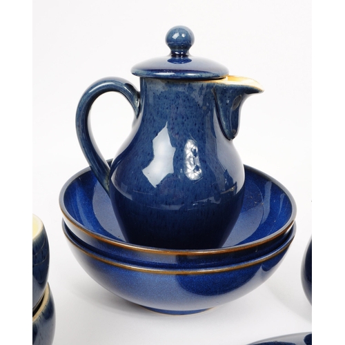 105 - A 20th century Denby part dinner service having a cobalt blue glaze consisting of various plates, di... 