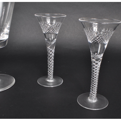 122 - A collection of seven 19th century George III cut glass pieces, comprised of four crystal twist stem... 