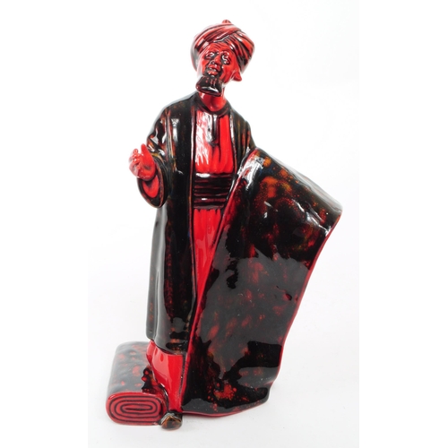 130 - Royal Doulton - 1990 porcelain Flambe 'The Carpet Seller' HN 2776 figurine. Featured in a black and ... 