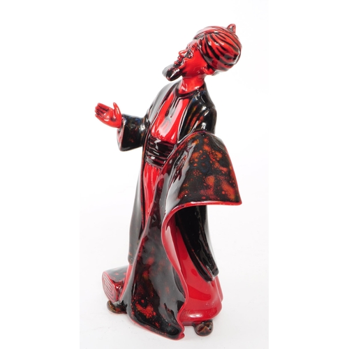 130 - Royal Doulton - 1990 porcelain Flambe 'The Carpet Seller' HN 2776 figurine. Featured in a black and ... 