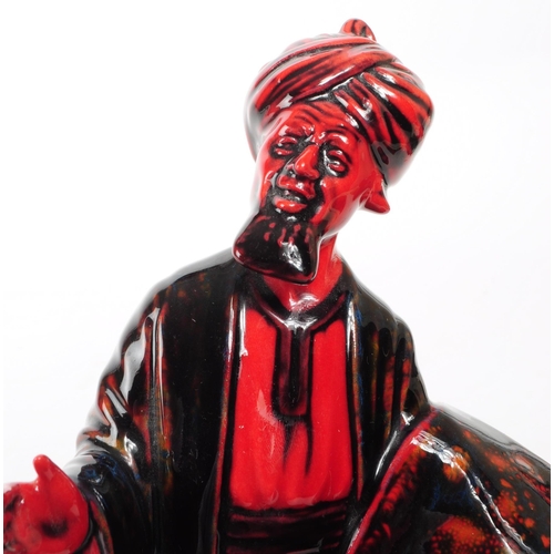 130 - Royal Doulton - 1990 porcelain Flambe 'The Carpet Seller' HN 2776 figurine. Featured in a black and ... 