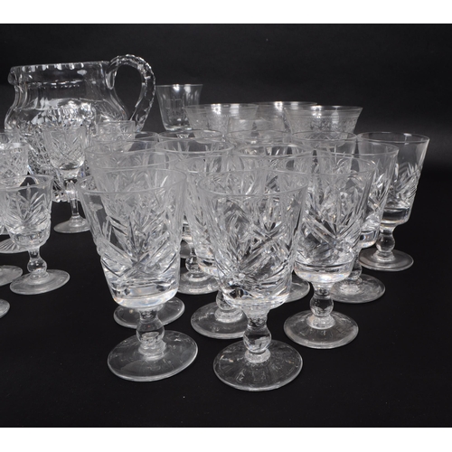 15 - A large collection of 20th century crystal cut drinking glasses, some examples by Thomas Webb, Stuar... 