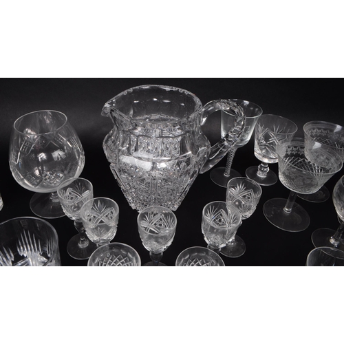 15 - A large collection of 20th century crystal cut drinking glasses, some examples by Thomas Webb, Stuar... 