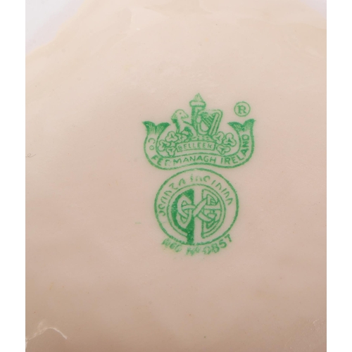 150 - Collection of Belleek Irish cream glazed porcelain pieces with green and black stamps to include jug... 