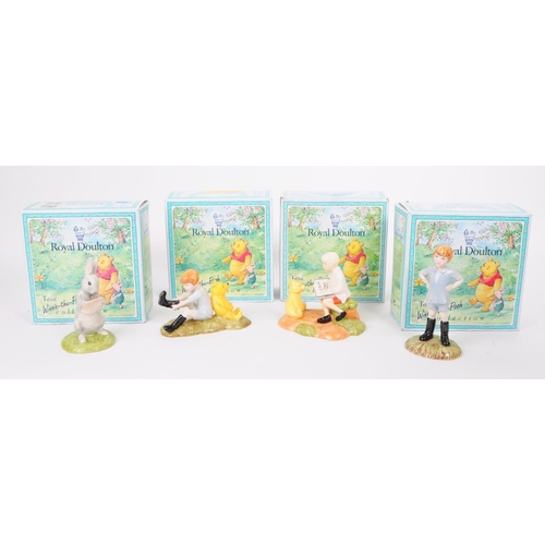 155 - Royal Doulton - Four late 20th century Winnie The Pooh figures. Comprised of Christopher Robin WP9, ... 