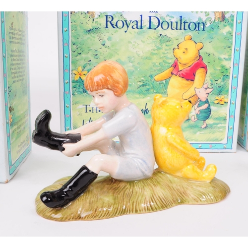 155 - Royal Doulton - Four late 20th century Winnie The Pooh figures. Comprised of Christopher Robin WP9, ... 