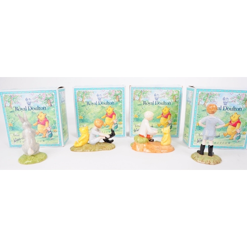 155 - Royal Doulton - Four late 20th century Winnie The Pooh figures. Comprised of Christopher Robin WP9, ... 