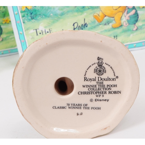 155 - Royal Doulton - Four late 20th century Winnie The Pooh figures. Comprised of Christopher Robin WP9, ... 