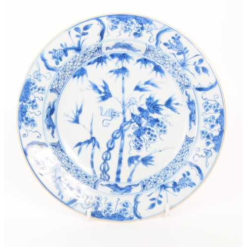 156 - An 18th Century Chinese porcelain blue and white plate of circular form with hand painted floral spr... 