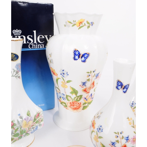 163 - Collection of nine 20th century bone china vases. Comprised of three Crown Devon small squat vases, ... 