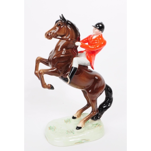 167 - Beswick - W. Goebel - Two vintage 20th century ceramic hunting equestrian figures. To include a Besw... 