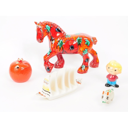 168 - A vintage mid 20th century Anita Harris Pottery ceramic horse, alongside other ceramic pieces. The c... 