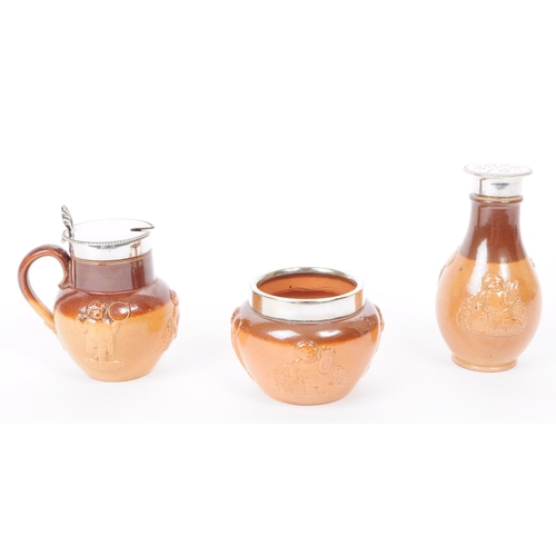 169 - Royal Doulton - An early 20th century Royal Doulton stoneware cruet set. The set having brown glaze,... 